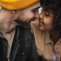 beautiful-young-couple-trying-to-kiss